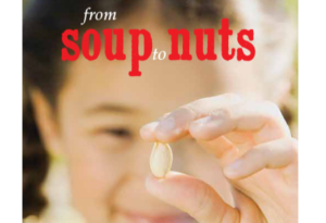 little kid holding a nut