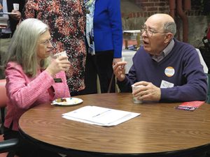 Two elderly people talking