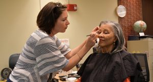 Women getting her makeup done